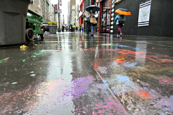 Colorful sidewalk splotches on a rainy day in midtown.